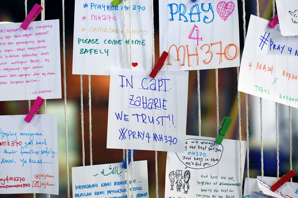 A message for pilot Zaharie Ahmad Shah (centre) is pictured at an event to express solidarity to the family members of passengers onboard the plane.