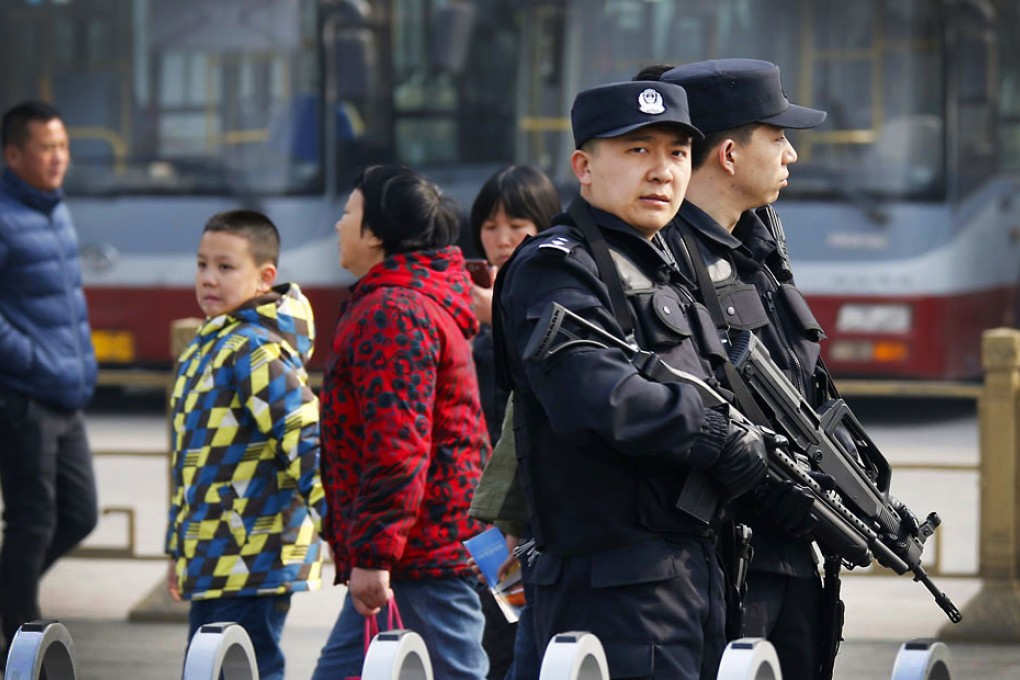 Armed police patrol near an entrance to Tiananmen Square in Beijing. Photo: Reuters