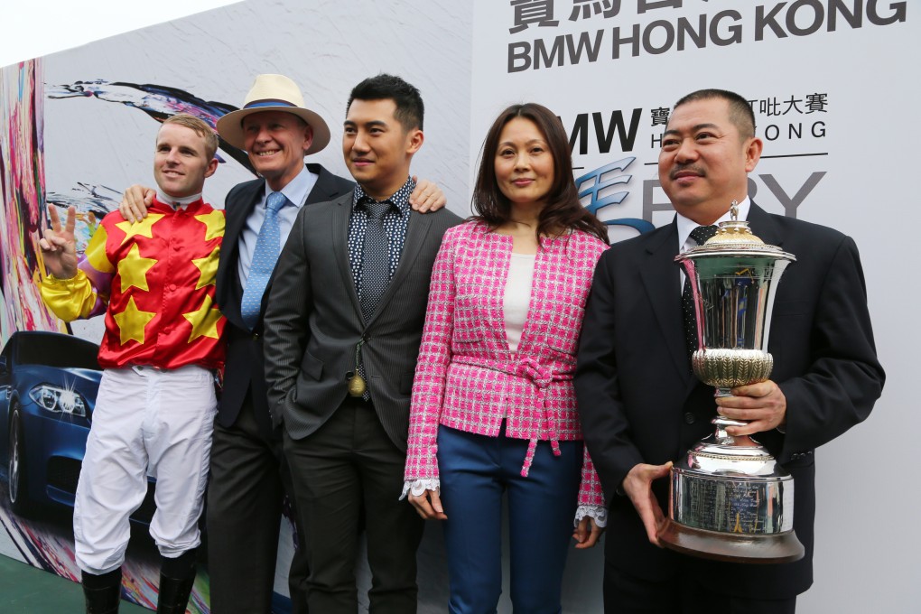 Jockey Tommy Berry, trainer John Moore and owner Cheng Keung-fai and his family celebrate Hong Kong Derby success with Designs On Rome. Photo: Kenneth Chan