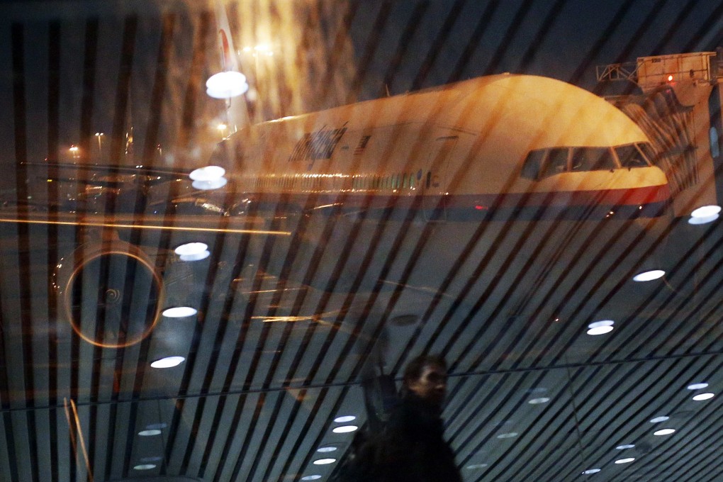 Malaysia Airlines Boeing 777-200ER flight MH318 to Beijing sits on the tarmac at Kuala Lumpur International Airport. Photo: Reuters