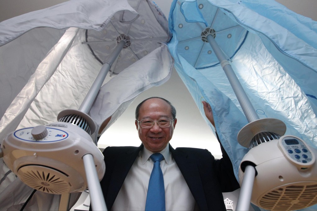 Professor Michael Hui tests out some clothes dryers. Photo: Nora Tam