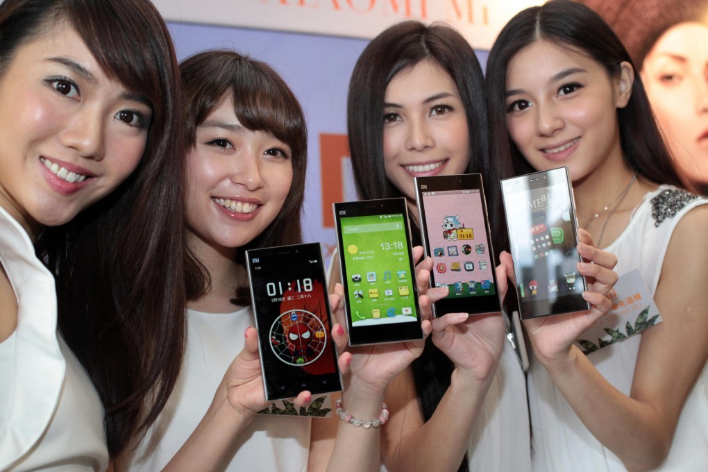 Xiaomi and Three Hong Kong form a model partnership for the launch of Xiaomi's flagship smartphone, the Mi3, yesterday. Photo: Thomas Yau