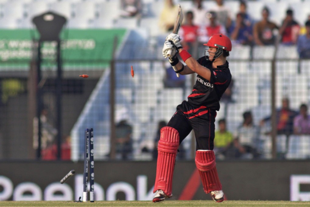 Hong Kong batsman Mark Chapman, who made 38, watches the bails fly after being bowled in the match against Afghanistan. Photo: AP