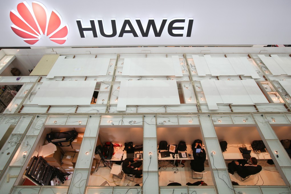 Staff members work at Huawei's stand of the CeBIT tech fair in Hanover, Germany. Photo: Xinhua