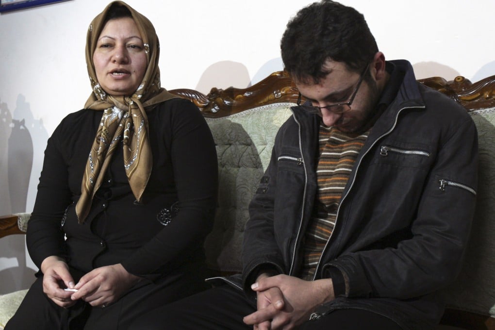Iranian Sakineh Mohammadi Ashtiani (left) who has been sentenced to death by stoning for adultery, speaks with media in a news briefing with her son, Sajjad in Iran 2011. Photo: AP
