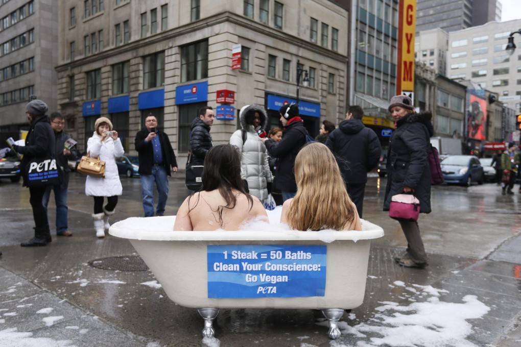 Chloe Kodrun and Nives Brkic, members of the animal-rights group, Peta, try to get their message across by sitting in a bath in Montreal, Canada, to mark today's UN-organised World Water Day. Photo: Reuters