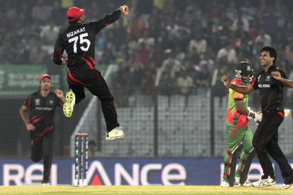 Hong Kong bowler Tanwir Afzal celebrates the dismissal of Bangladesh's Tamim Iqbal during their ICC Twenty20 Cricket World Cup match in Chittagong, Bangladesh. Photos: AP