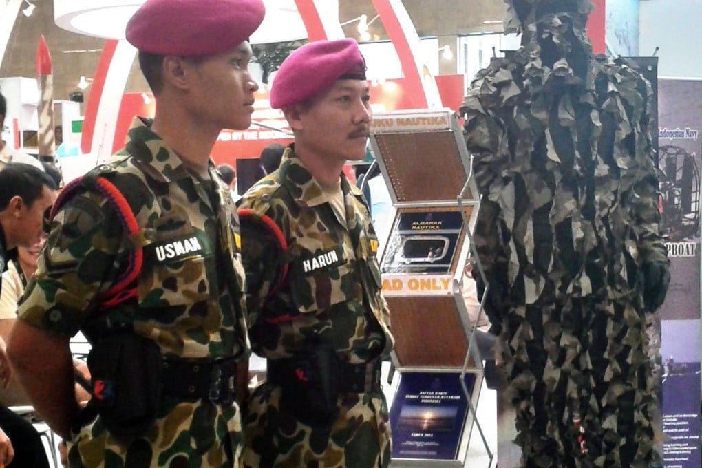 Two Indonesian marines dressed as the men who were executed for a 1965 bombing in Singapore that killed three people. Photo: AFP