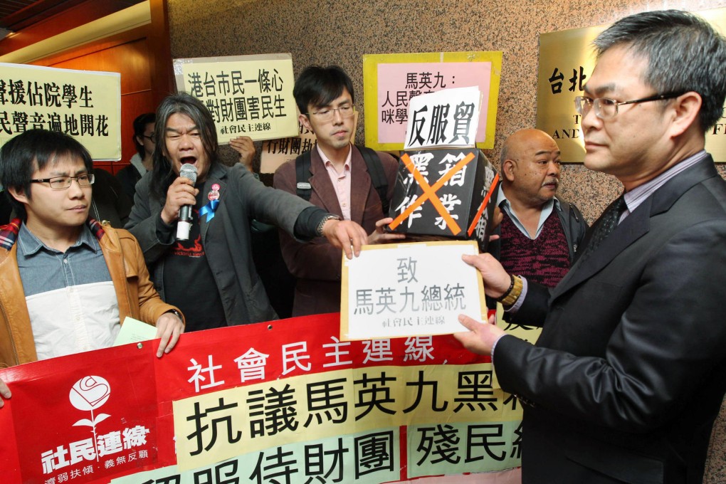 "Long Hair" Leung Kwok-hung (second from left) and others present their petition to the Taipei representative office. Photo: SCMP Pictures