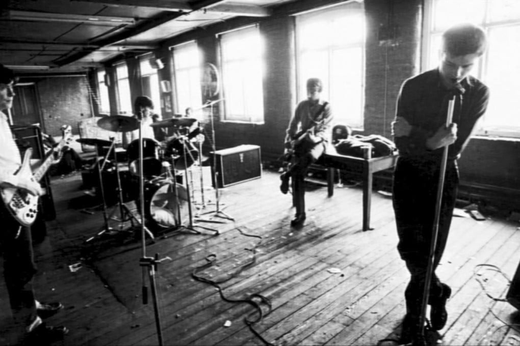 Left to right: Bernard Sumner, Stephen Morris, Hook and Ian Curtis as Joy Division.
