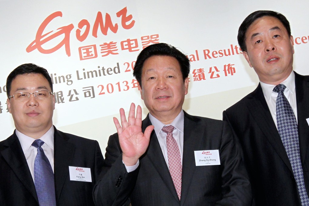 Gome's chief financial officer Fang Wei (left) and Chairman Zhang Dazhong see strong growth next year. Photo: Edward Wong