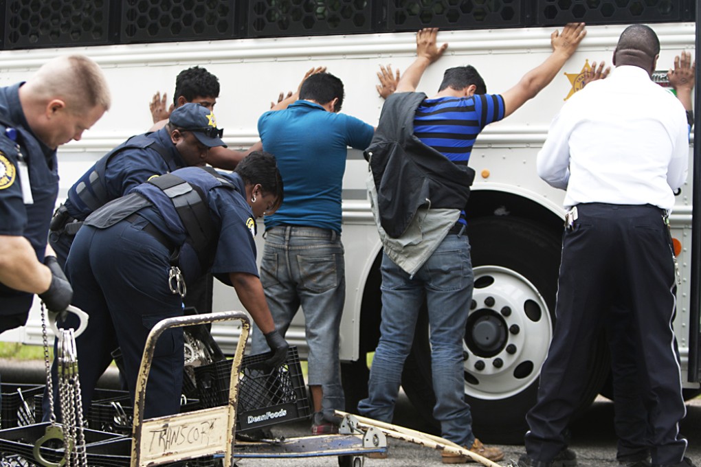 Authorities search people in southeast Houston. Photo: AP