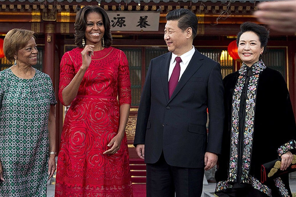 Michelle Obama, her mother Marian Robinson share a light moment with Chinese President Xi and his wife Peng Liyuan after a photograph session at the Diaoyutai State guest house in Beijing. Photo: Reuters
