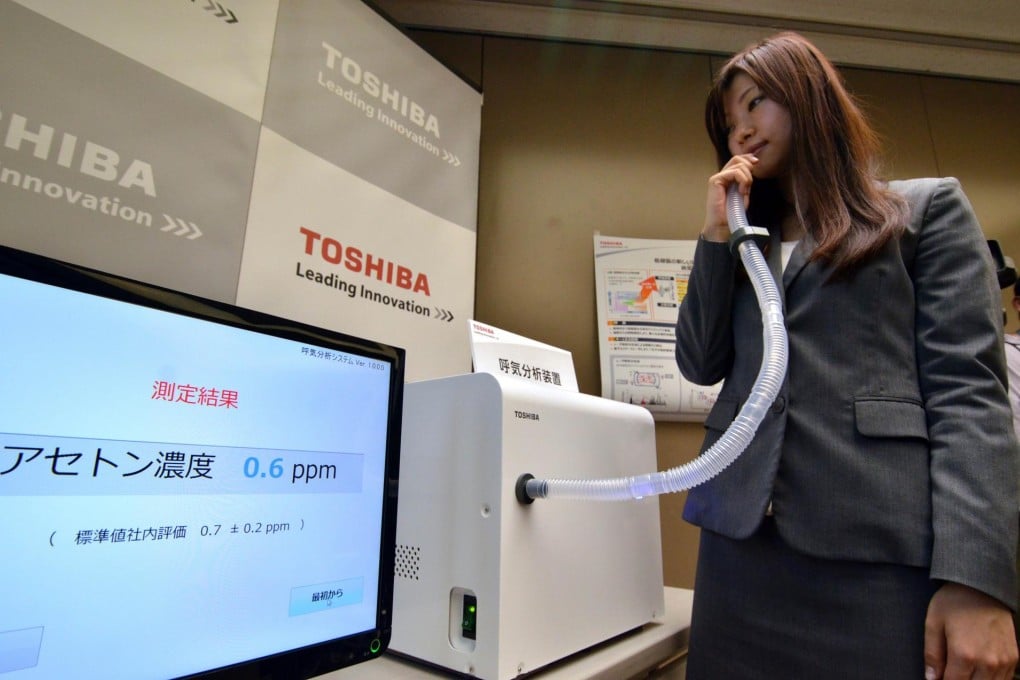 Toshiba's prototype disease breathalyser. Photo: AFP