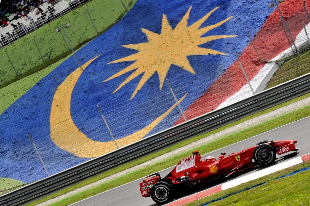 Many viewers will be asking how a big Formula One carnival can be held in Malaysia amid the drama of a missing plane. Photo: AFP