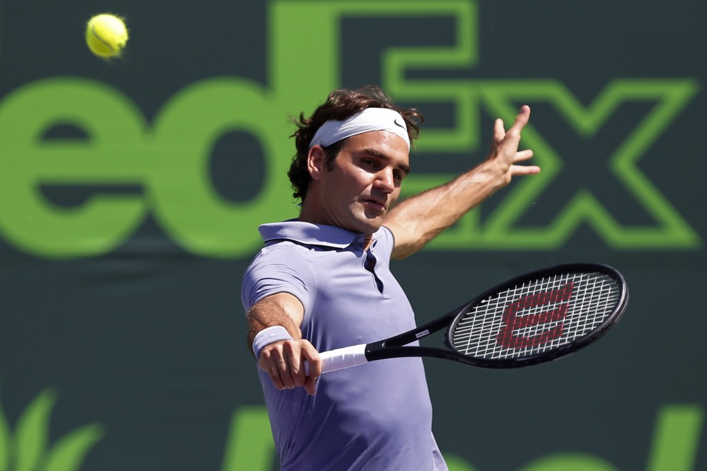 Roger Federer returns a shot on his way to victory over Ivo Karlovic. Photo: USA Today