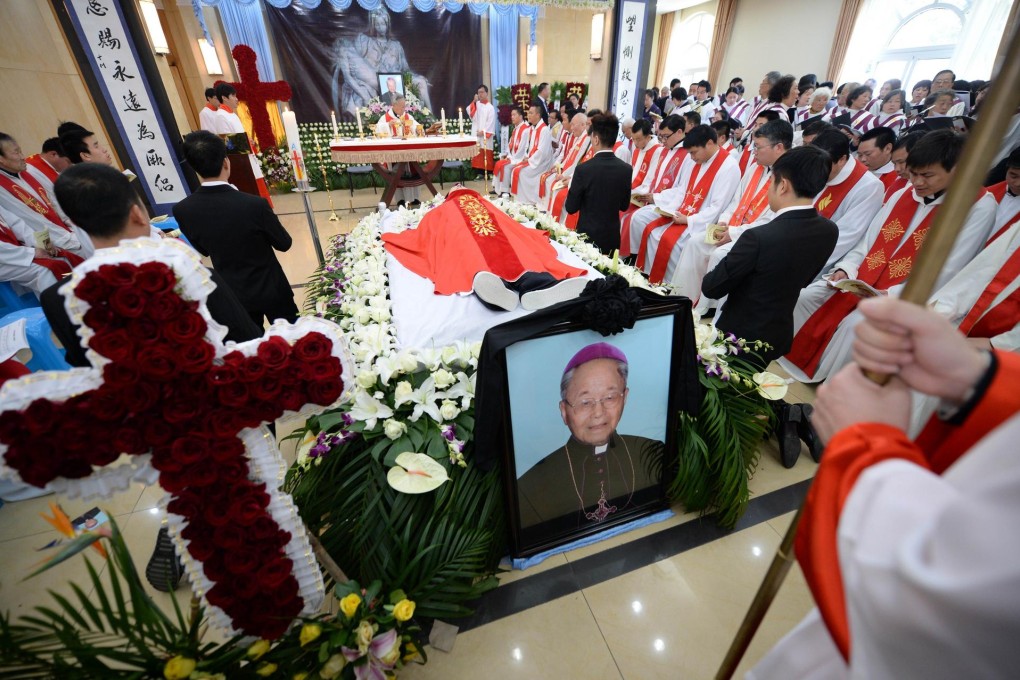 Clergy and mourners offer prayers at the funeral of underground church leader bishop Joseph Fan Zhongliang in Shanghai. Photo: AFP