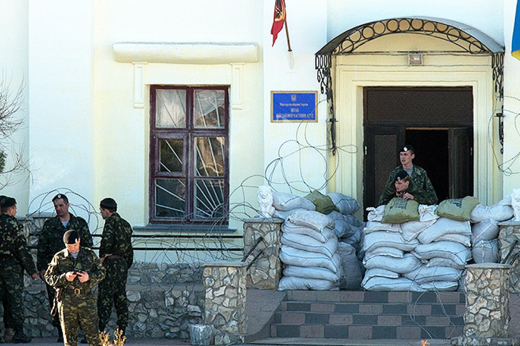 Ukrainian soldiers guard a naval base in the Crimea. Photo: AFP