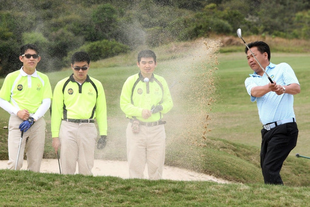 Cheung Kwai-hong teaches students Curtis Siu Jon, Yau Chi-him and Man Chi-leung at the Kau Sai Chau Public Golf Course. Photo: Dickson Lee