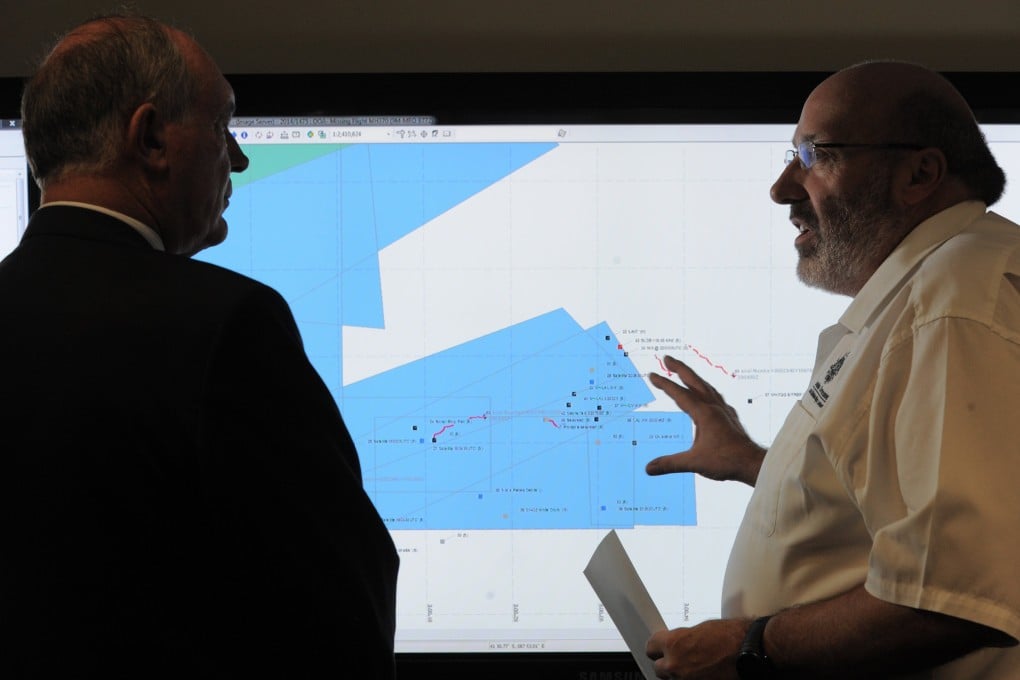 Mike Barton, rescue coordination chief, right, shows Australia's Deputy Prime Minister, Warren Truss, the map of the Indian Ocean search areas. Photo: AP