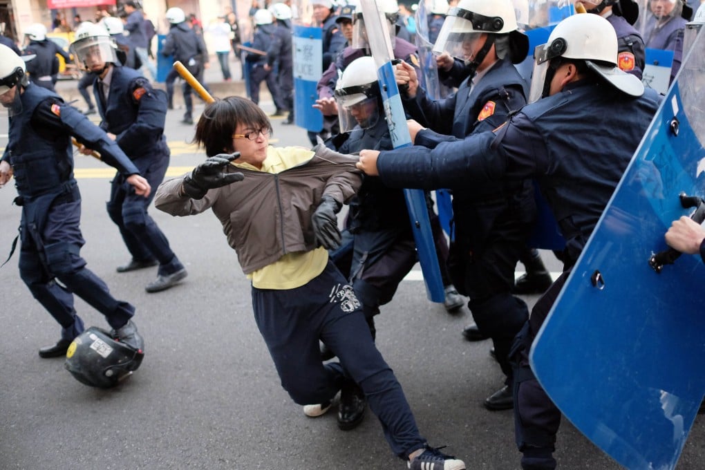 Protesters clash with police in Taipei yesterday. Photo: AFP