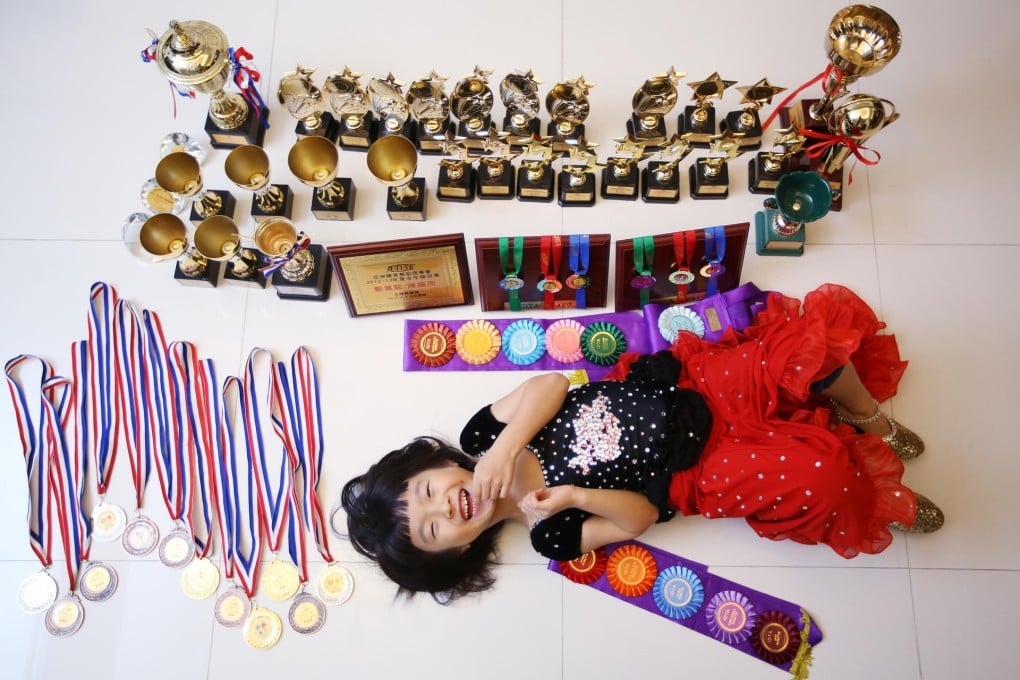 Dance prodigy Pearl Chan Pui-yee with her trophies. She will soon take an exam to become an assistant dance teacher. Photo: Sam Tsang