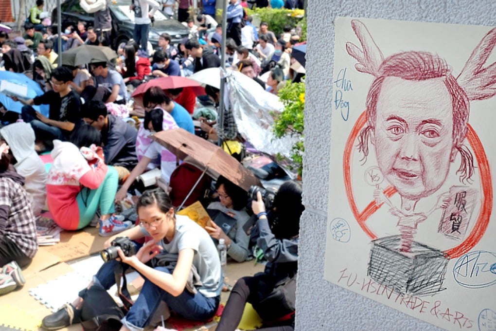 Student protesters with a caricature of Ma Ying-jeou. Photo: AFP