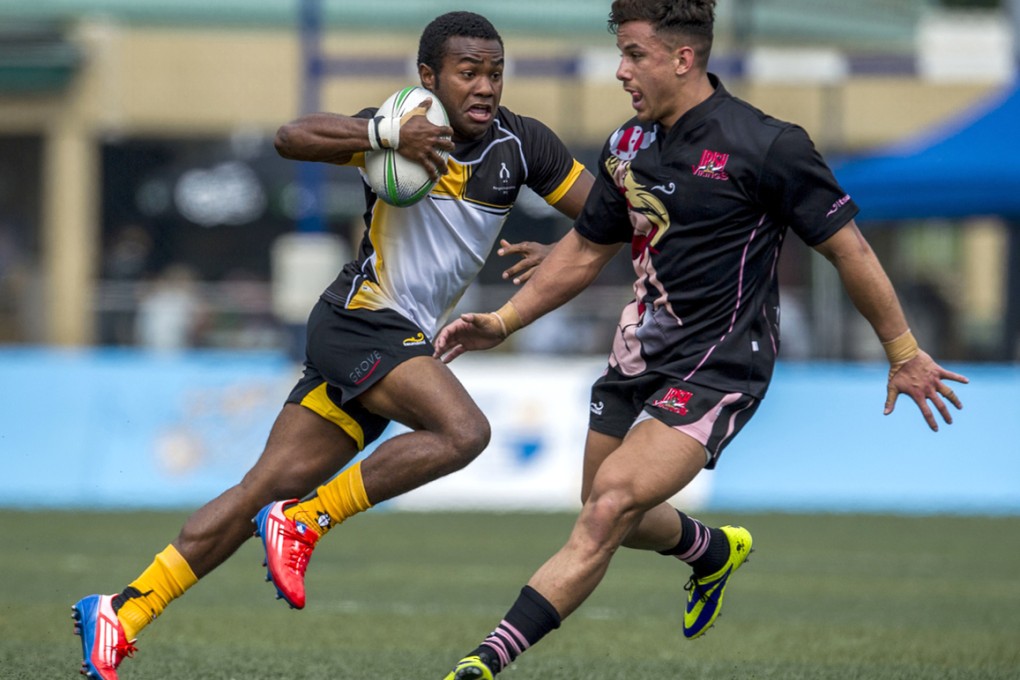 Varasiko Duisokosoko of Penguins takes on Ollie Marchon of Irish Vikings on day one of the GFI HKFC Tens. Photos: SCMP Pictures