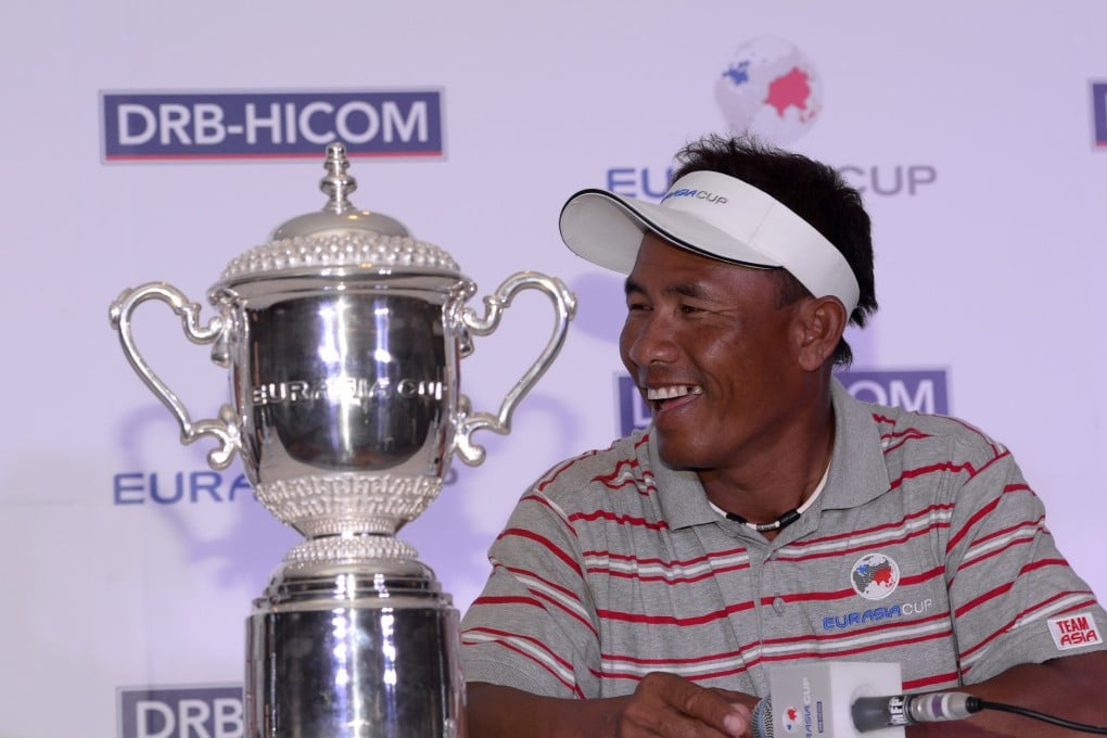 Team Asia captain Thongchai Jaidee admires the new cup up for grabs this week. Photo: Asian Tour