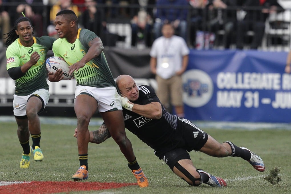 New Zealand's DJ Forbes gets to grips with South Africa's Sampie Mastriet in the final of the USA Sevens. South Africa won that one, but New Zealand got revenge on home turf. South Africa have been in five of the six finals so far, winning two, and could be set for another showdown with the Kiwis (two wins from four finals) on Sunday.  Photos: AFP / SCMP