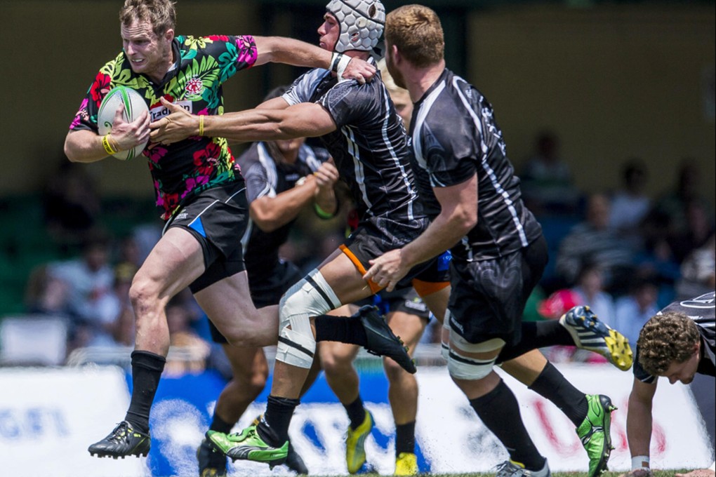 Mark Jackman of Tradition YCAC tries to break clear of the JML IRANZ defence on day two of the GFI HKFC Tens.