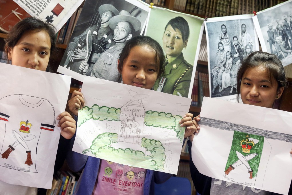 Nepali students at a workshop show off drawings for a Gurkha memorial that will be displayed at Ancestors' Day. Photo: K.Y. Cheng