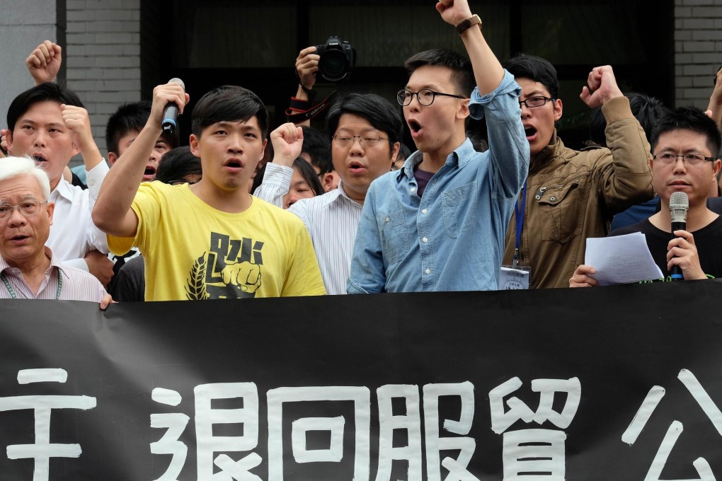 Protesters, including leader Lin Fei-fan (front right), outside Taiwan’s legislature yesterday. Photo: AFP