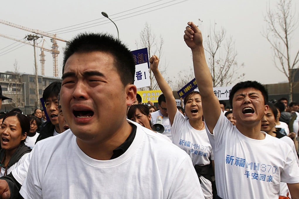Family members of passengers onboard Malaysia Airlines MH370 during a protest in front of the Malaysian embassy in Beijing. Photo: Reuters