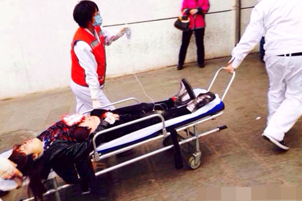 An injured woman is rushed to hospital in northern Beijing. Photo: SCMP Pictures