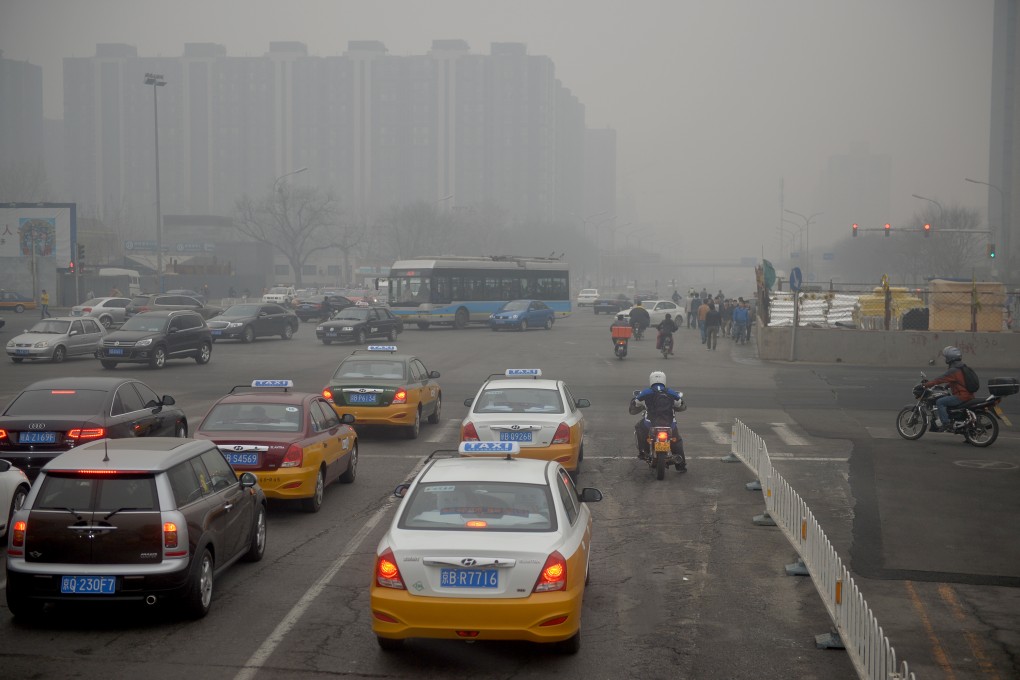 Traffic slowed in Beijing on Thursday. A yellow smog alert has been in effect in the capital since Monday. Photo: Xinhua