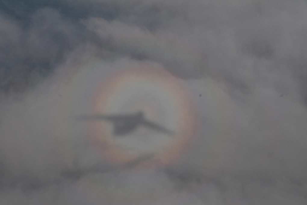 A Chinese air force transport plane flies over the southern Indian Ocean. It was one of 10 aircraft taking part in the search for MH370 yesterday. Photo: Xinhua