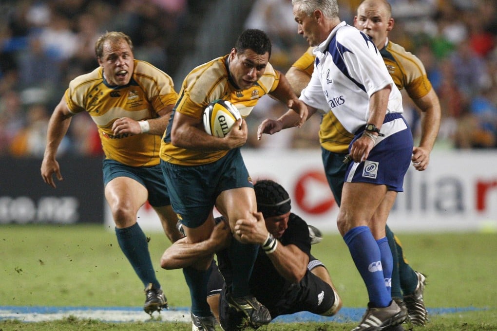 George Smith is tackled by All Black Anthony Boric in their historic Bledisloe Cup match in Hong Kong in 2008. The Wallabies lost 19-14. Photo: Reuters