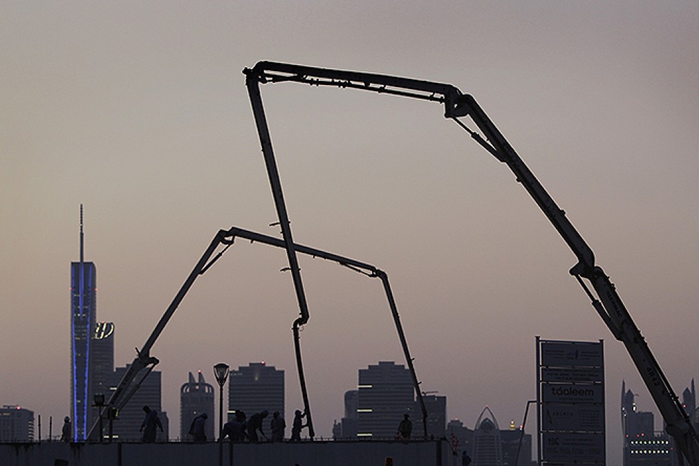 Asian labourers work on a Dubai construction site. Many profitable companies ignore ethical practices. Photo: AP