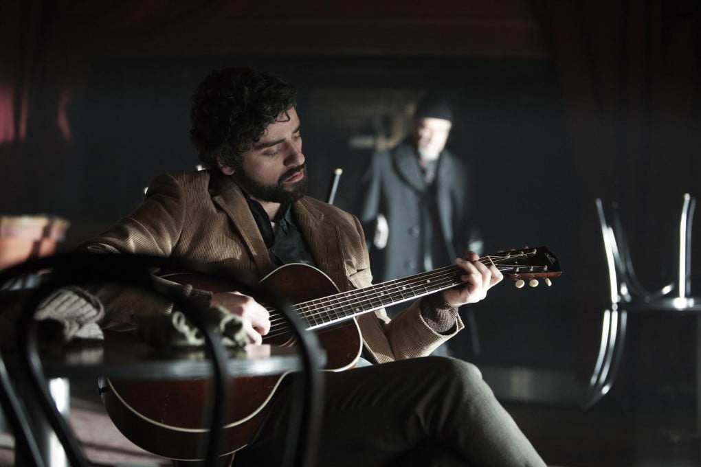 Oscar Isaac plays Llewyn Davis.