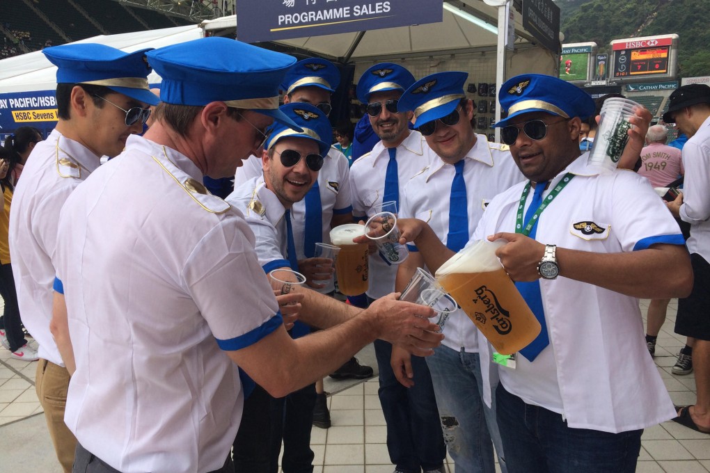 A group of fans dress up as pilots on the first day of the Sevens in Causeway Bay. Photo: Kenny Hodgart