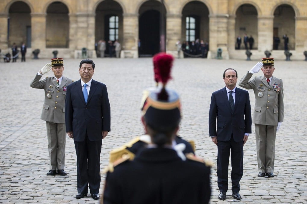 Xi Jinping and French President Francois Hollande at a ceremony in Paris. Photo: Reuters