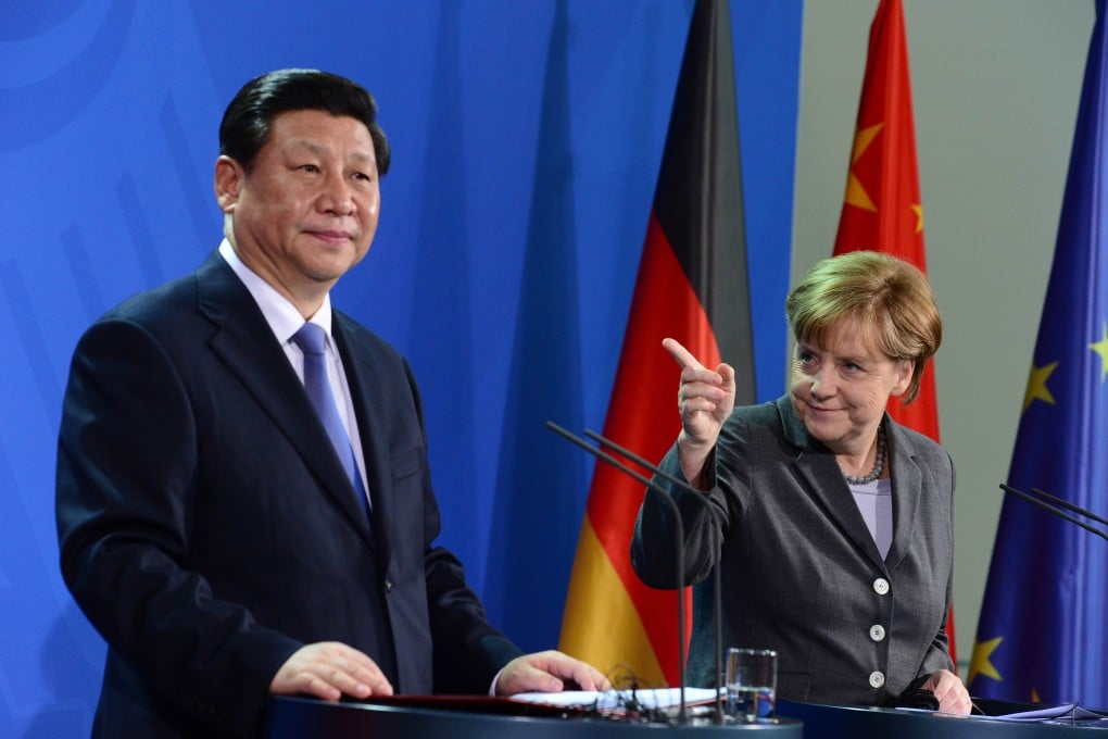 Xi Jinping and Angela Merkel face the media in Berlin yesterday after signing political and economic agreements. Photo: AFP