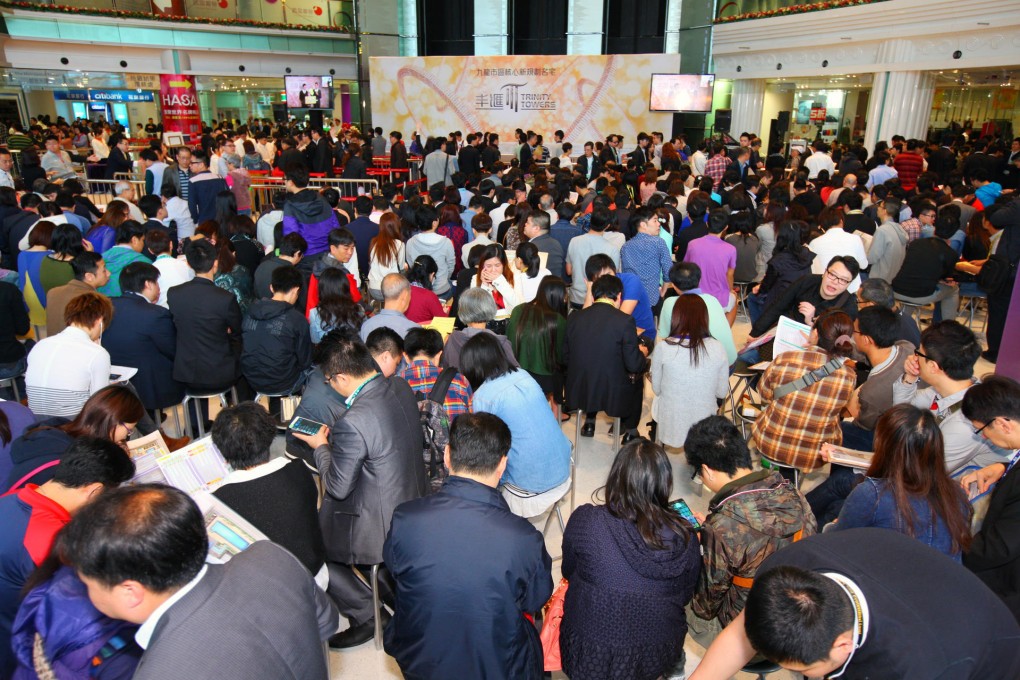 Buyers rush to sign up for the first release of flats at Trinity Towers at the weekend. One-bedroom units sold for as low as HK$3.26 million. Photo: Cheung Kong