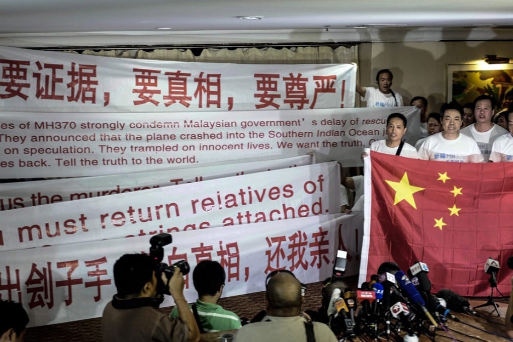 Relatives of Chinese passengers on board Malaysia Airlines flight MH370 carry banners that read, "We want evidence. We want truth. We want our family", while demanding to meet officials from Malaysia Airlines, the government, search and rescue teams and the aircraft's US manufacturer Boeing.