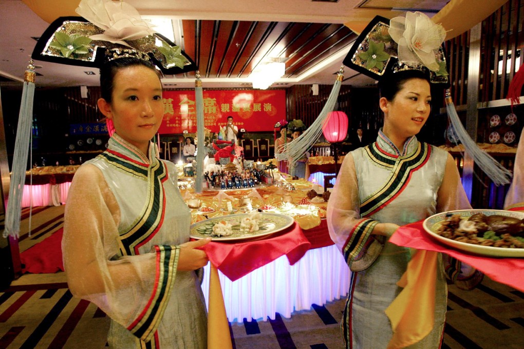 Goodbye to all that. Extravagant entertainment like this faux Qing imperial dinner are off the menu. Photo: AFP