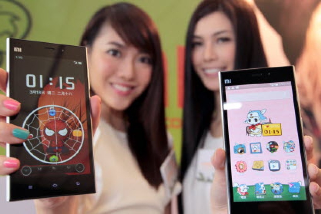 Models show off the newest Xiaomi phone models during a Hong Kong press conference. Photo: Thomas Yau