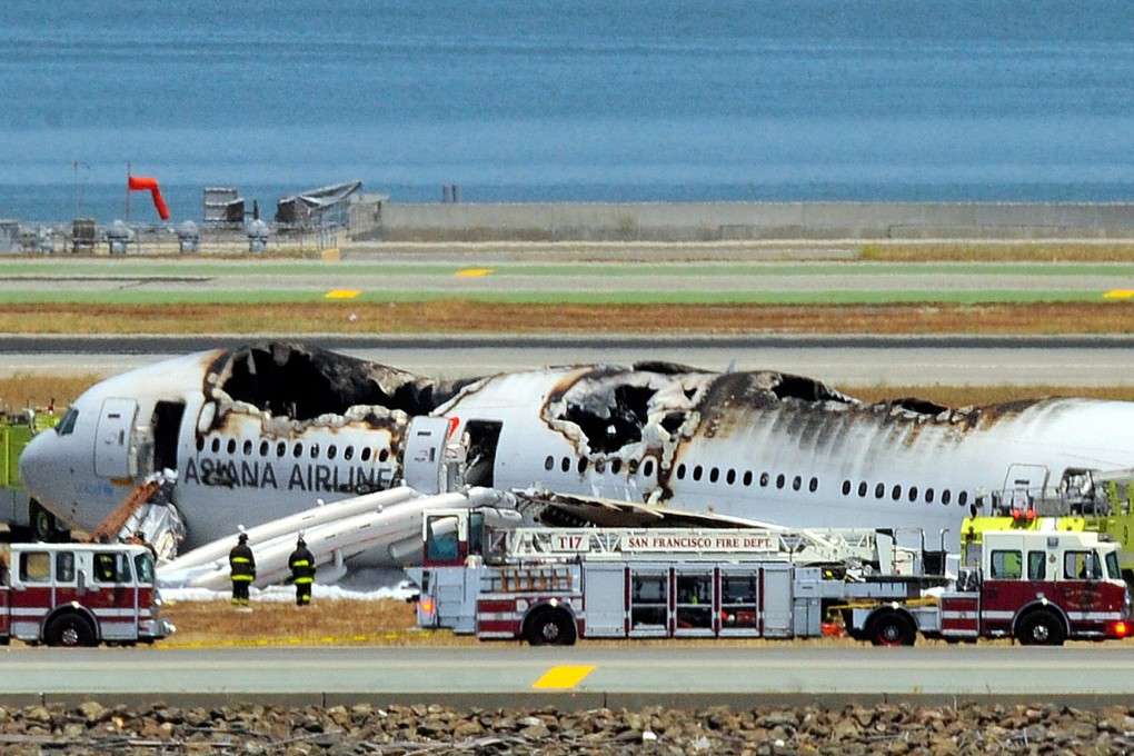 The Asiana Airlines Boeing 777 on the runway at San Francisco International Airport after the crash landing on July 6, 2013, Photo: AFP