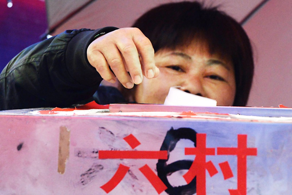 A local resident votes during elections in the village of Wukan. Photo: AFP