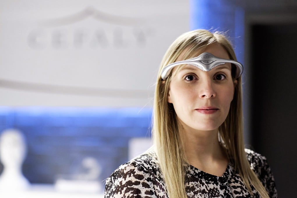 A model wears the classic model of Cefaly Technology's new head band device to be used against migraines. Photo: AFP